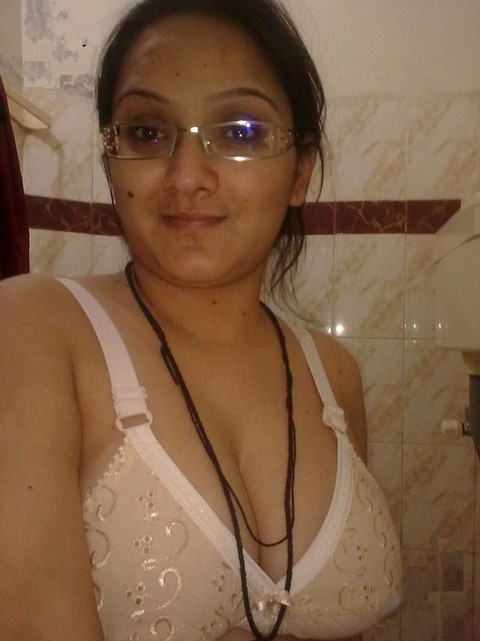 Overweight Indian student shows her bare mid-section in a brassiere