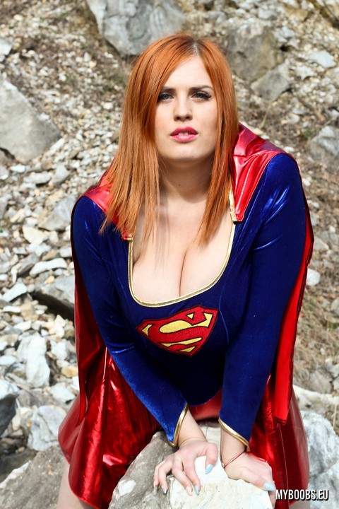 Thick redhead Alexsis Faye releases her giant tits from Superman osutfit | Фото 4