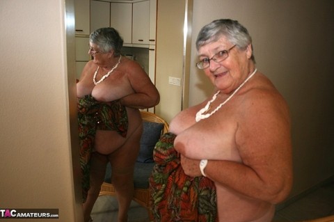 Silver haired granny Grandma Libby exposes her obese figure afore a mirror | Фото 9