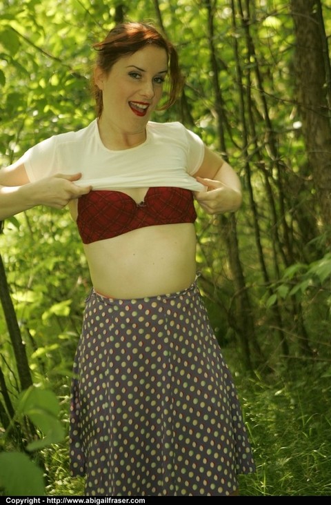 Redhead amateur pulls down satin panties in the woods before dressing | Фото 11