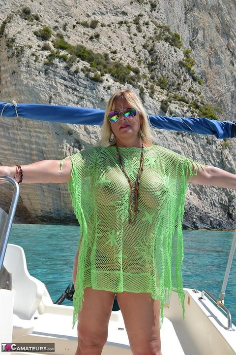 Beefy big Nude Chrissy pilots her boat naked to sun her round plump tits | Фото 13