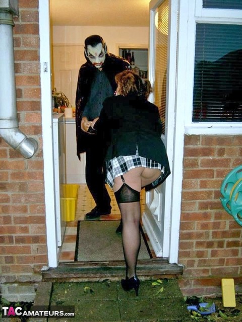 UK redhead Curvy Claire blows a man that is dressed as Dracula for Halloween