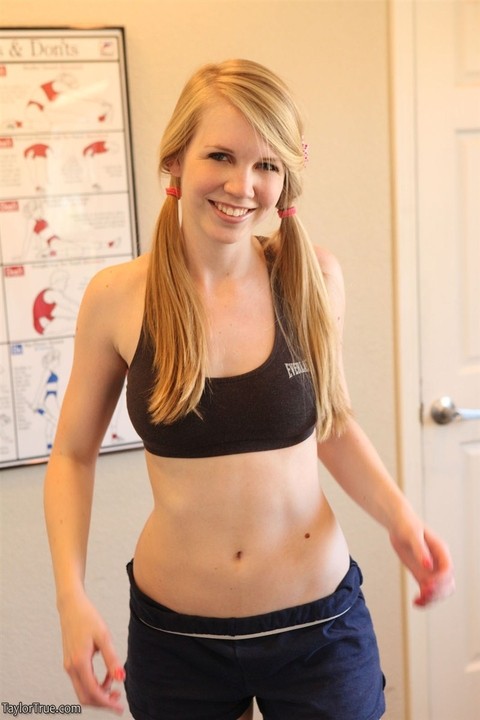 Blonde amateur Taylor True pulls workout shorts over her bare ass in pigtails | Фото 7