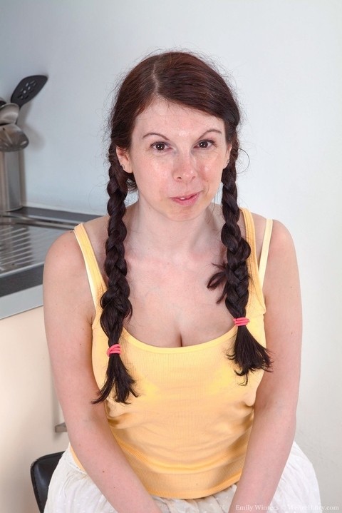 Brunette amateur Emily Winters shows off her really hairy pussy in pigtails | Фото 1