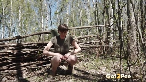 Caucasian girl Mariam takes a piss near a wattle fence in the woods | Фото 4