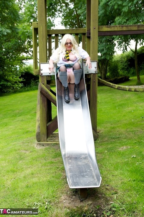 Old UK amateur Barby Slut exposes herself on a playground in schoolgirl attire | Фото 9