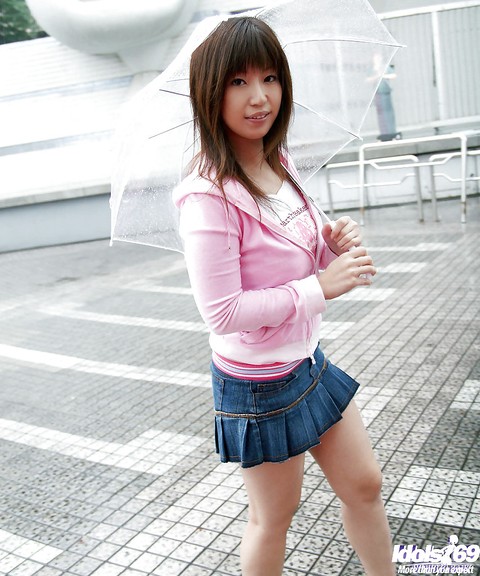 Seductive asian babe in miniskirt uncovering her tempting curves | Фото 1