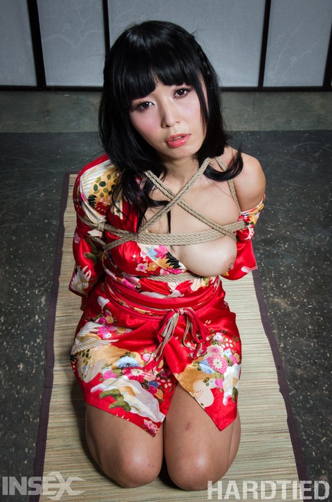 Beautiful Asian girl Marica Hase is suspended by ropes with red toenails | Фото 1