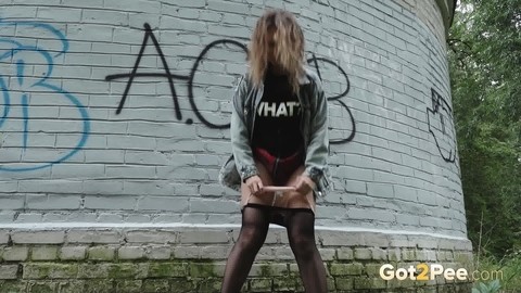 Solo girl Rita wipes herself after taking a piss near a graffitied building | Фото 13