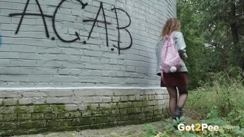 Solo girl Rita wipes herself after taking a piss near a graffitied building | Фото 15