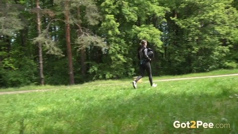 Brunette chick Barbe takes a piss on a bench beside a walking path | Фото 14