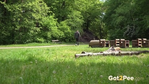 Brunette chick Barbe takes a piss on a bench beside a walking path | Фото 15