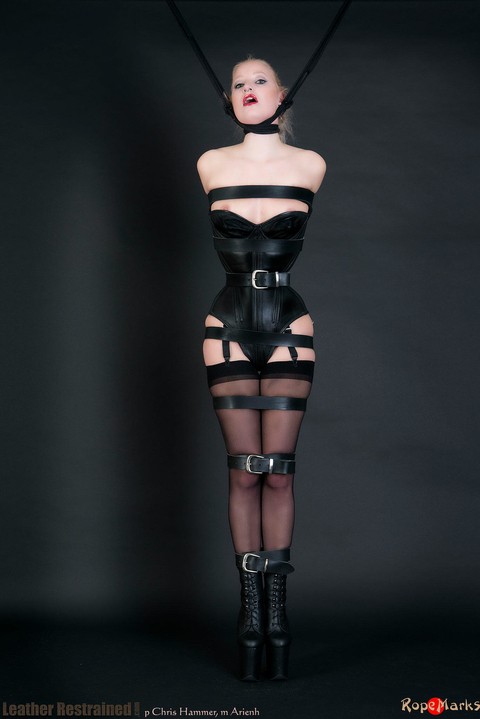 Pale blonde Chris Hammer models a bondage neck corset and a corset in bondage | Фото 12