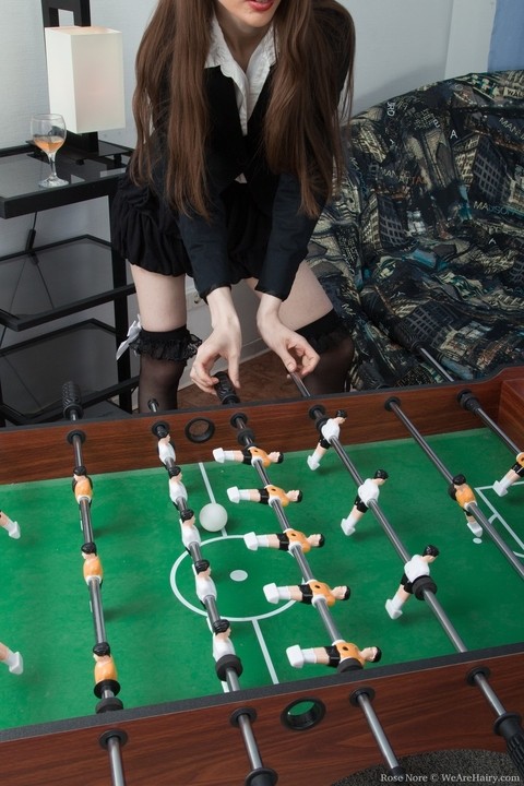 Petite Rose Nore strips & spreads her hairy pussy while playing table soccer | Фото 2