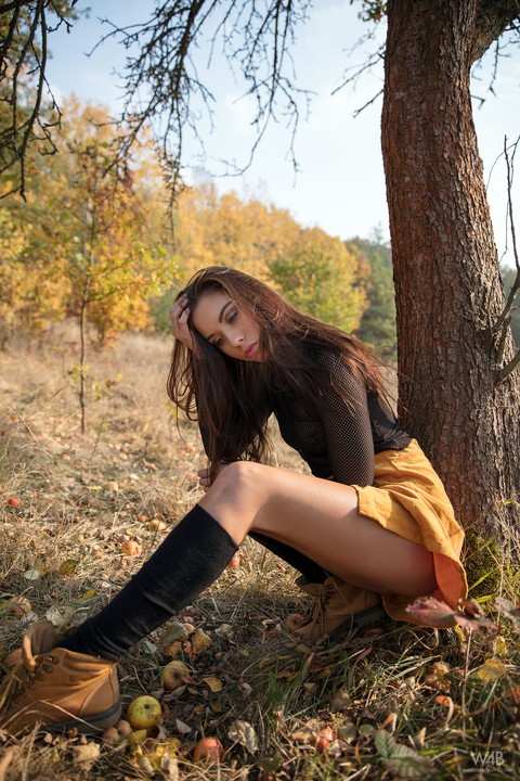 Glam model Sabrisse shows landing strip pussy in black knee socks under a tree | Фото 1