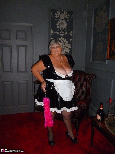 Fat old maid Grandma Libby doffs her uniform to pose nude in stockings