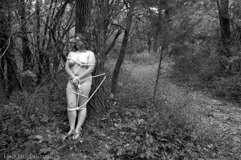 Overweight female is tied to a tree in the woods while naked and blindfolded | Фото 16