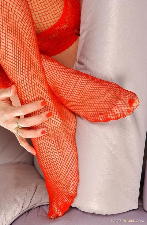 Skinny chick in red fishnet stockings Jennifer enjoys solo foot fetish action | Фото 6