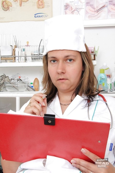 Chubby blonde nurse Iva Wild posing in hot uniform and pantyhose | Фото 1