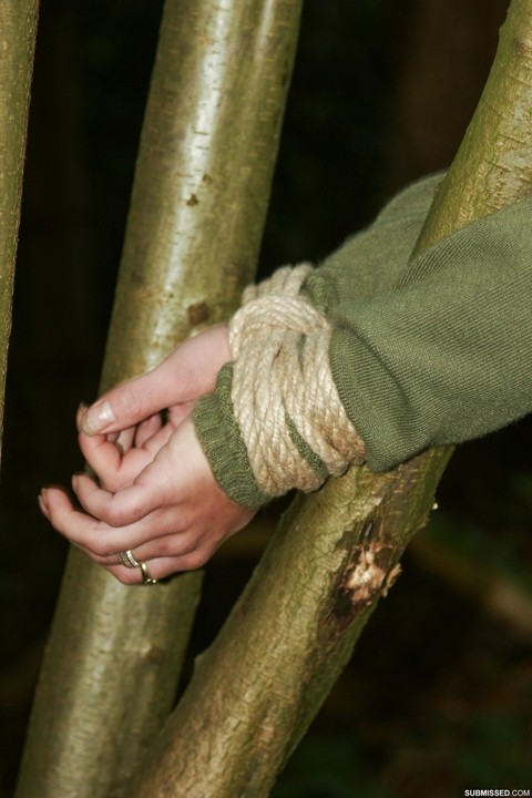 Sexy black haired Vixen gagged & roped up in jeans & boots & tied to a tree | Фото 16