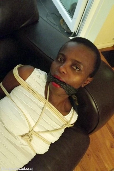 Black female is left tied and cleave gagged in a white dress on a leather sofa | Фото 14