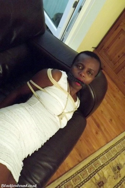 Black female is left tied and cleave gagged in a white dress on a leather sofa | Фото 16