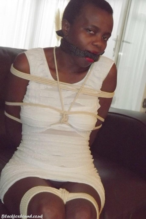 Black female is left tied and cleave gagged in a white dress on a leather sofa | Фото 5