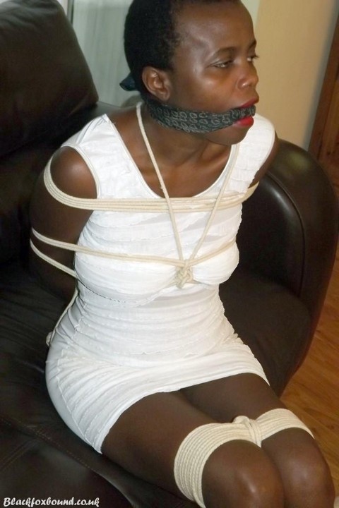 Black female is left tied and cleave gagged in a white dress on a leather sofa | Фото 8