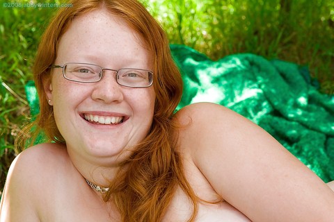 Ugly redhead chick in glasses strips naked outdoors for pussy spreading | Фото 15