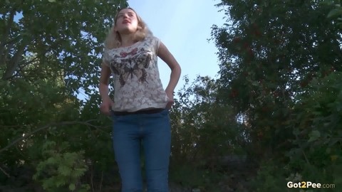 Blonde female Sasha is captured while taking a piss on a rocky bank | Фото 14