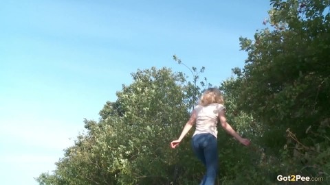 Blonde female Sasha is captured while taking a piss on a rocky bank | Фото 15