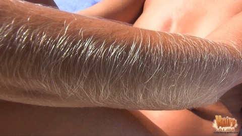 MILF Lori Anderson showing her hairy arms while relaxing nude at the beach | Фото 2