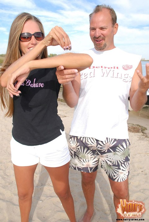 Hot blonde Lori Anderson in shorts flaunting her long arm hair on the beach | Фото 14