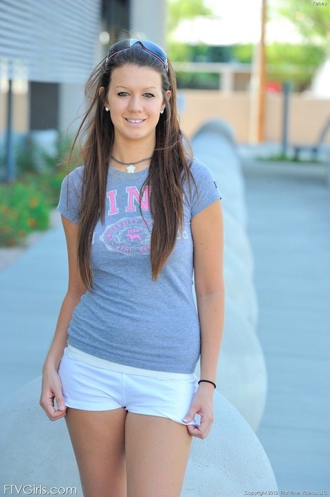 Girl next door type sets her great body free of clothing outside condo complex