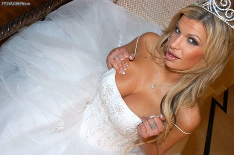 Gorgeous bride Kendall Brooks teases with plentiful cleavage in wedding gown