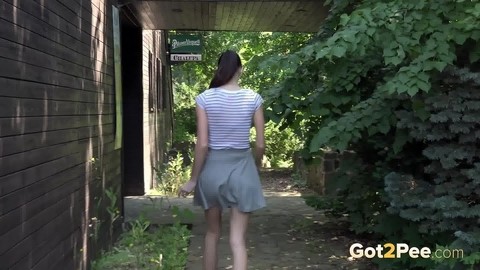 Brunette girl Eveline Neill hitches up her skirt to take a much needed pee | Фото 15