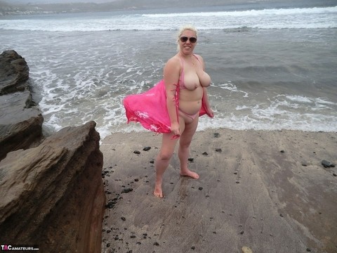 Older platinum blonde Barby exposes her plump body at the seaside