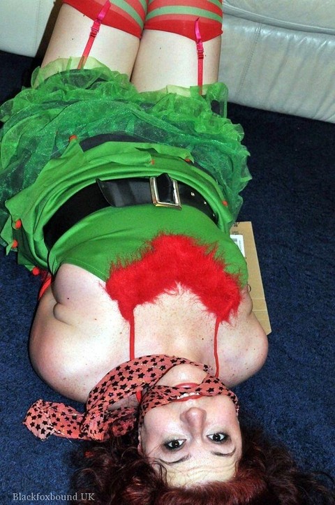 Busty redhead is restrained and gagged in Christmas outfits | Фото 4