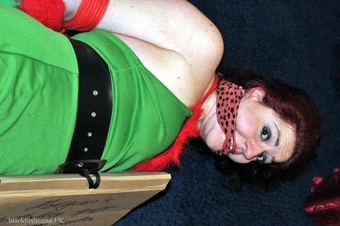 Busty redhead is restrained and gagged in Christmas outfits | Фото 7