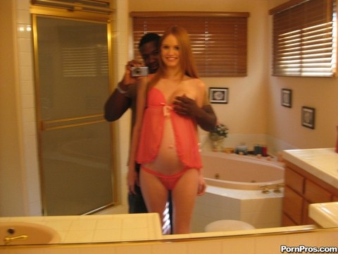 Pregnant redhead Layla Exx poses for the photoshoot with black guy