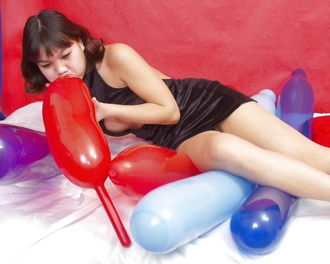 Naughty thai girl in sexy dress playing with a big red balloon | Фото 7