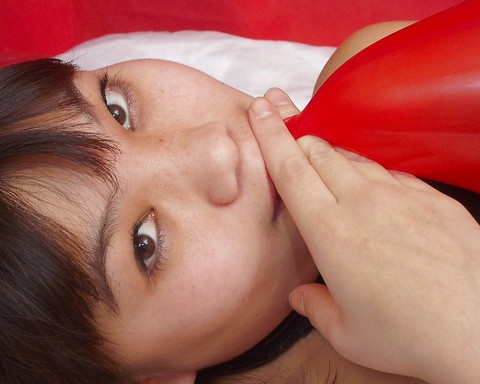 Naughty thai girl in sexy dress playing with a big red balloon | Фото 9