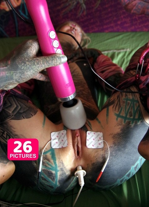 Heavily tattooed girl Anuskatzz is masturbated while awaiting a big black cock