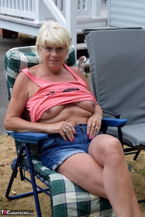 Older blonde Dimonty gets naked in a trailer park during solo action | Фото 9