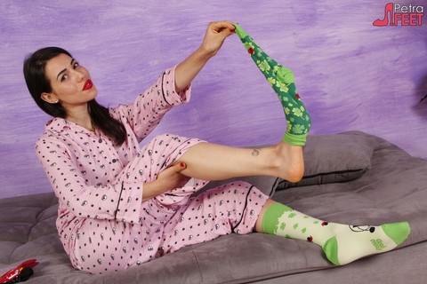 Brunette female Petra frees her pretty feet from socks in her pyjamas | Фото 4