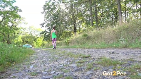 European female Valentina Ross squats for a pee while strolling a country road | Фото 15