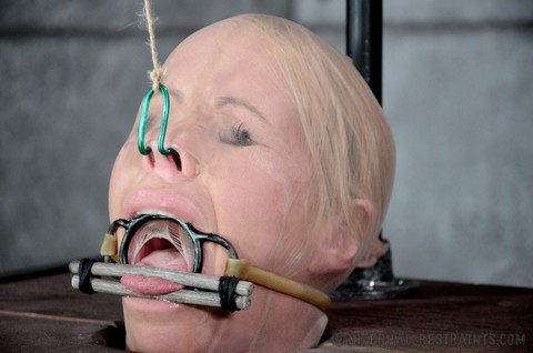 Blonde female Simone Sonay is rendered helpless in a basement dungeon | Фото 1