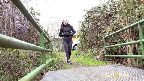 Solo girl Victoria Daniels squats to take a piss before crossing a footbridge | Фото 2