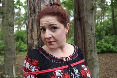 Thick redhead is cleave gagged and tied to a tree in a forest | Фото 7