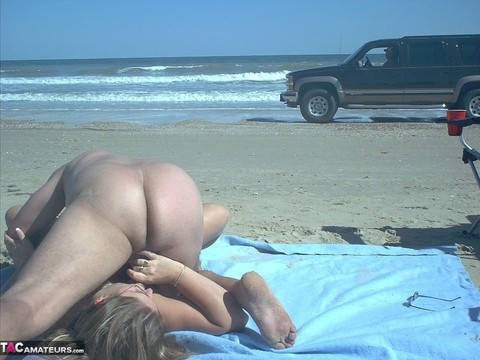 Glasses wearing amateur BBW gets gangbanged on a nude beach | Фото 19